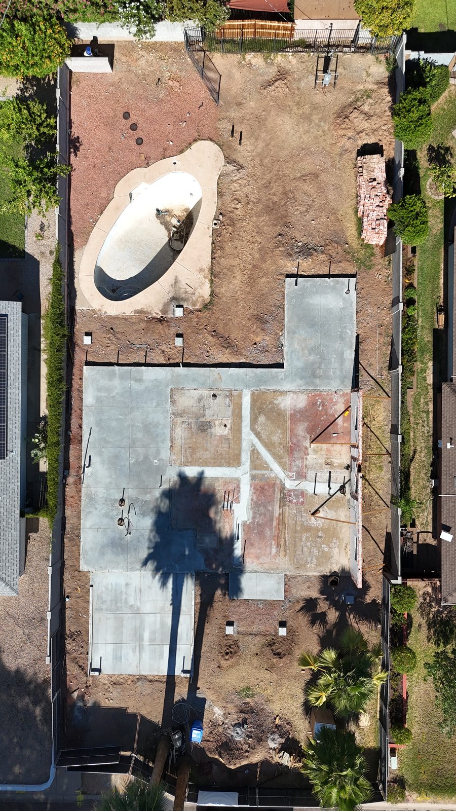 Overhead view of the new foundation showing the full footprint and the existing pool