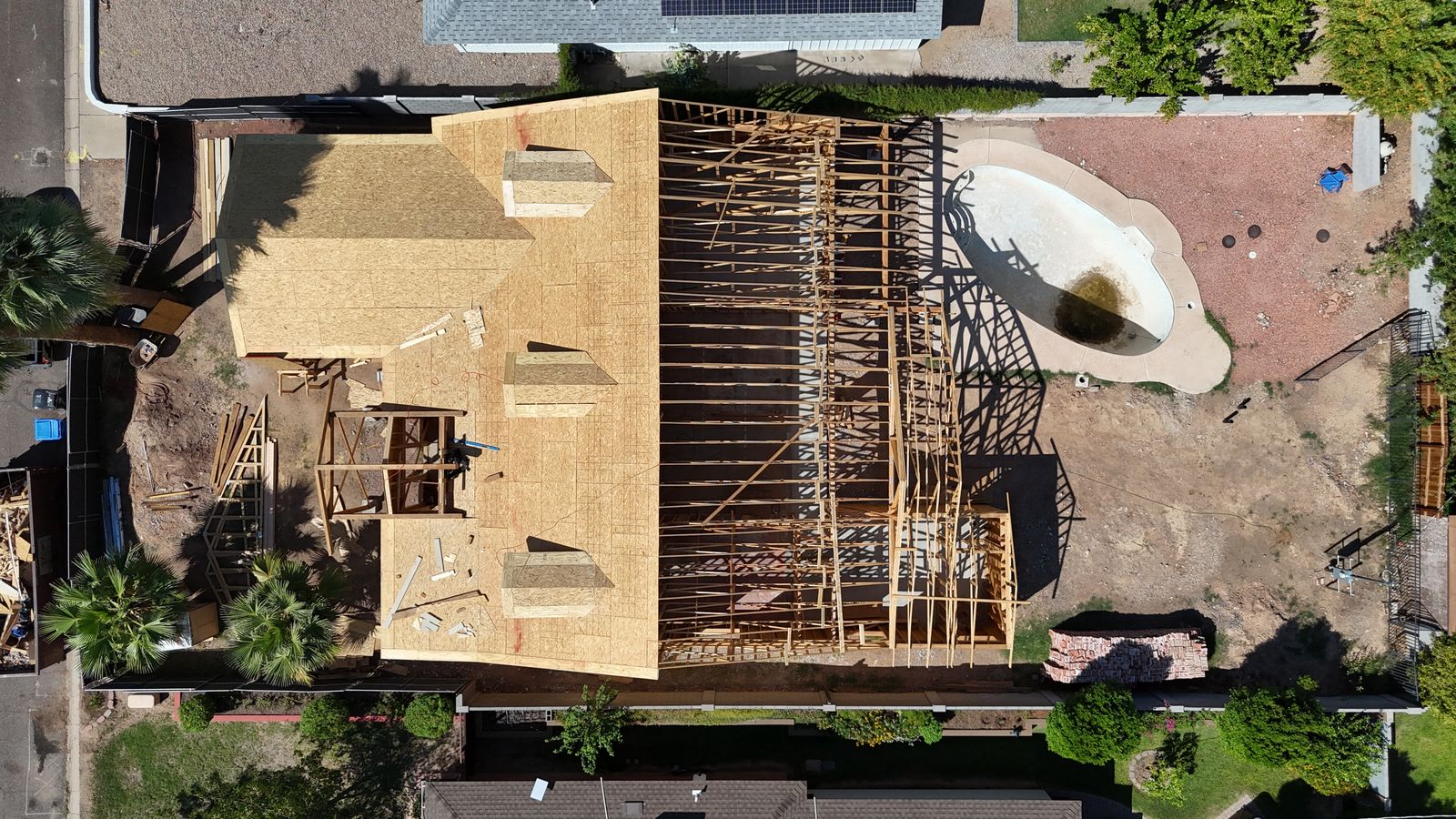 Overhead aerial view of the roof trusses and framing layout across the full footprint